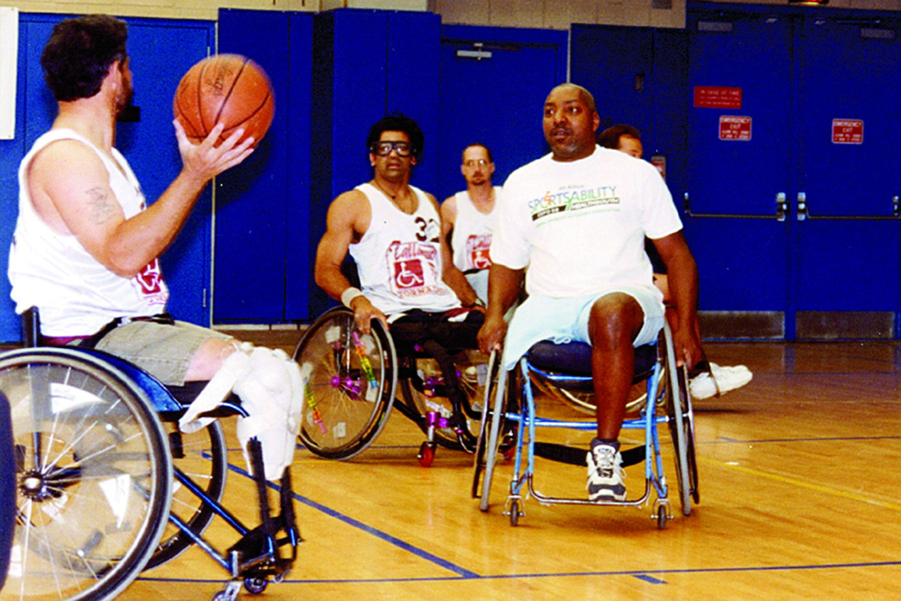 Image of Men Playing Wheelchair Basketball